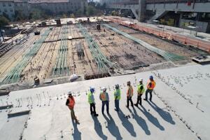 Aerial view of a modular construction site with workers reviewing logistics