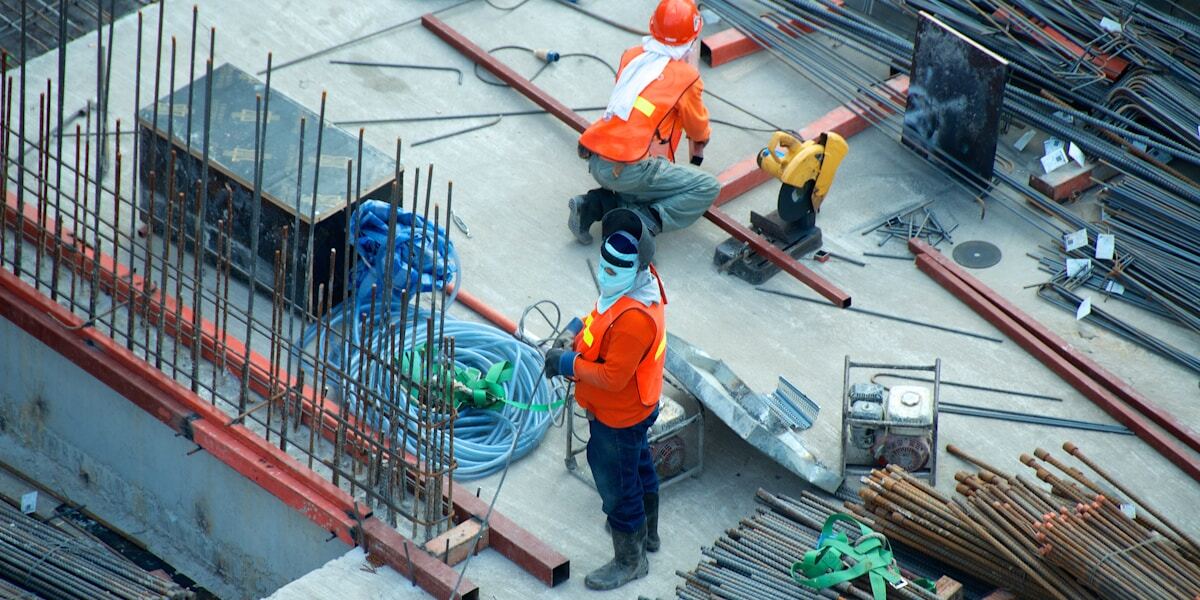 Modular construction units being craned into position on an urban site